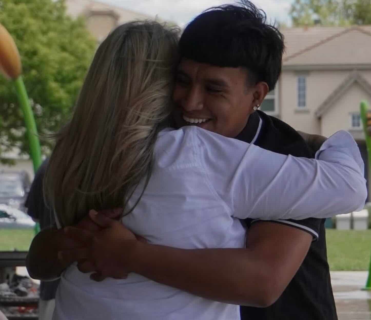 Jenn Souza welcoming her son to the Disability Pride Month picnic