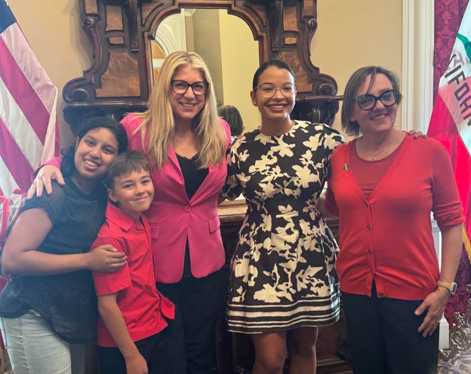 Jenn Souza celebrating Dominique Donnette's swearing in